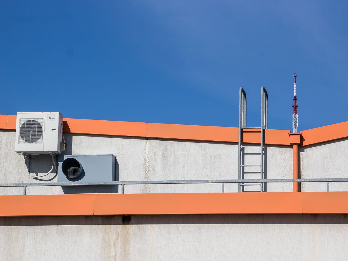 Rooftop package HVAC unit against a clear Arizona sky